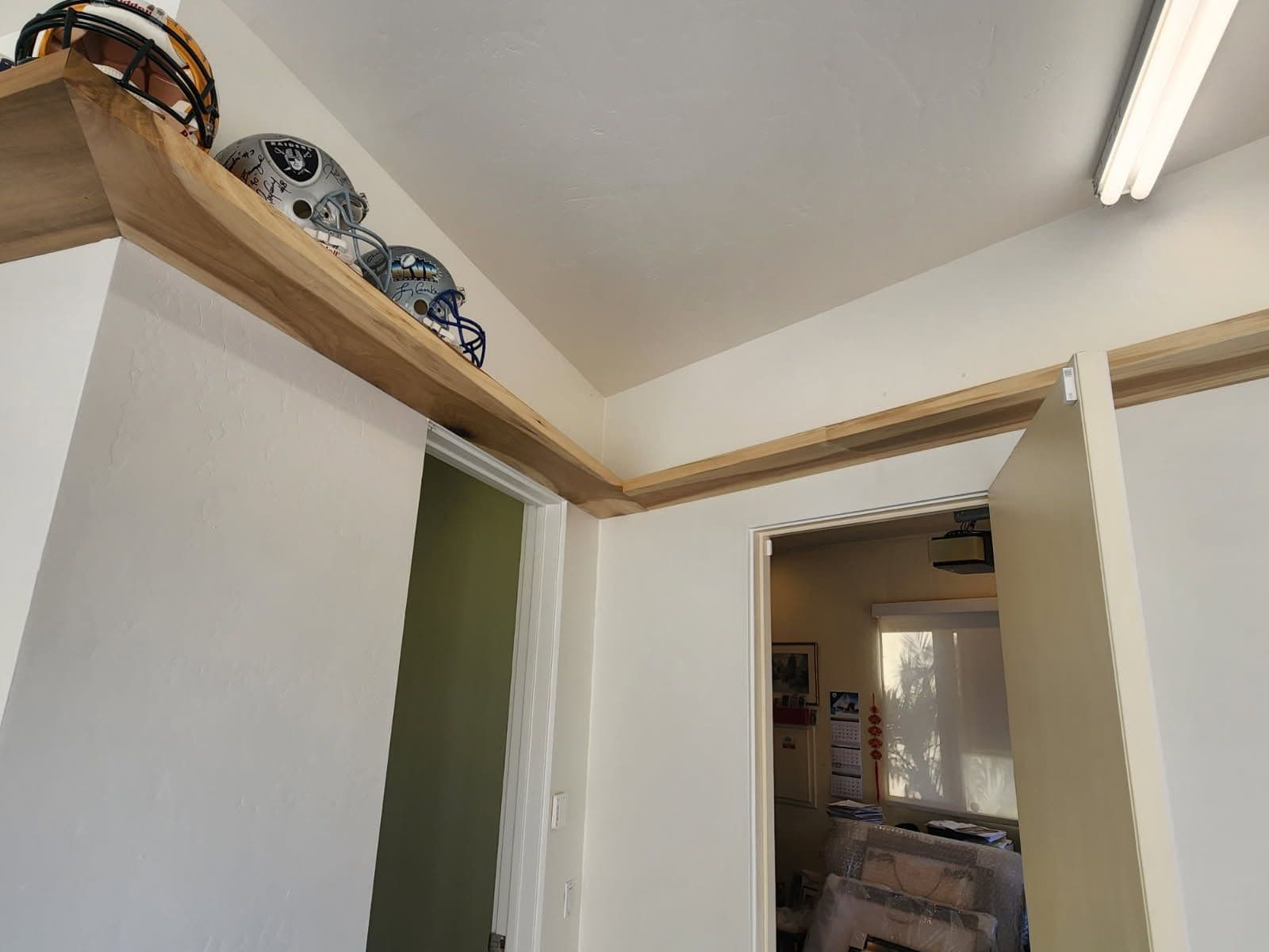 Gallery photos for Innovative Floating Memoraibliia Shelf Installation: Image #2