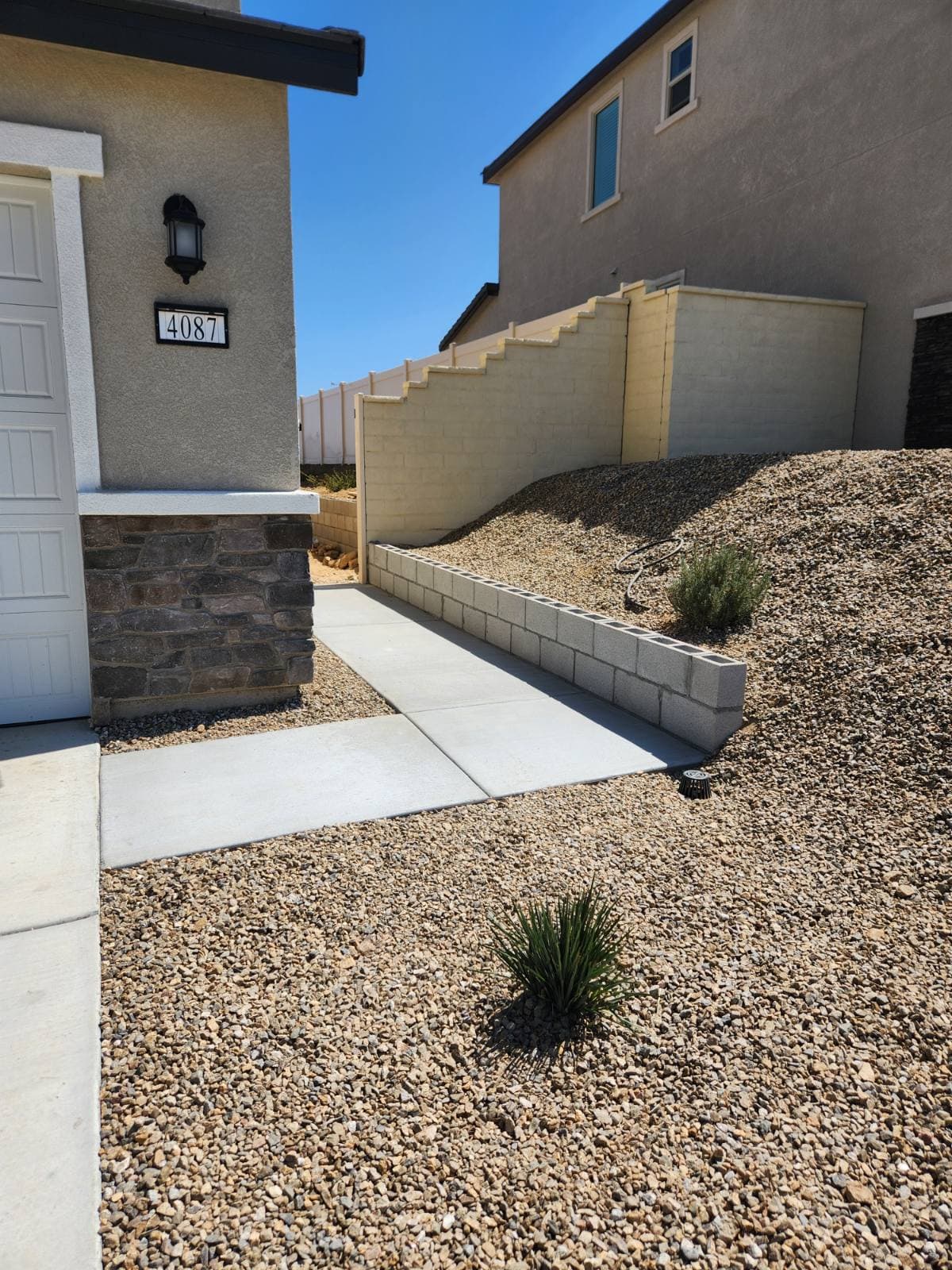 Expert Concrete Pathway and Retaining Wall Transformation image